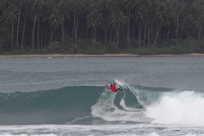 ndonesian surf star Dede Suryana (IDN) attacking the lip on Day 1 of the Nias Pro.