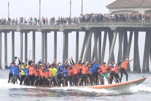World&#039;s largest surfboard: 66 catch a wave and ride their way to a record